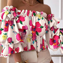 ™Blommig blus med prickmönster och vida ärmar