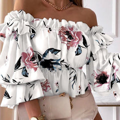 ™Blommig blus med prickmönster och vida ärmar
